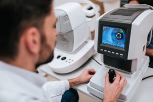 doctor ophthalmologist is checking the eye vision of woman