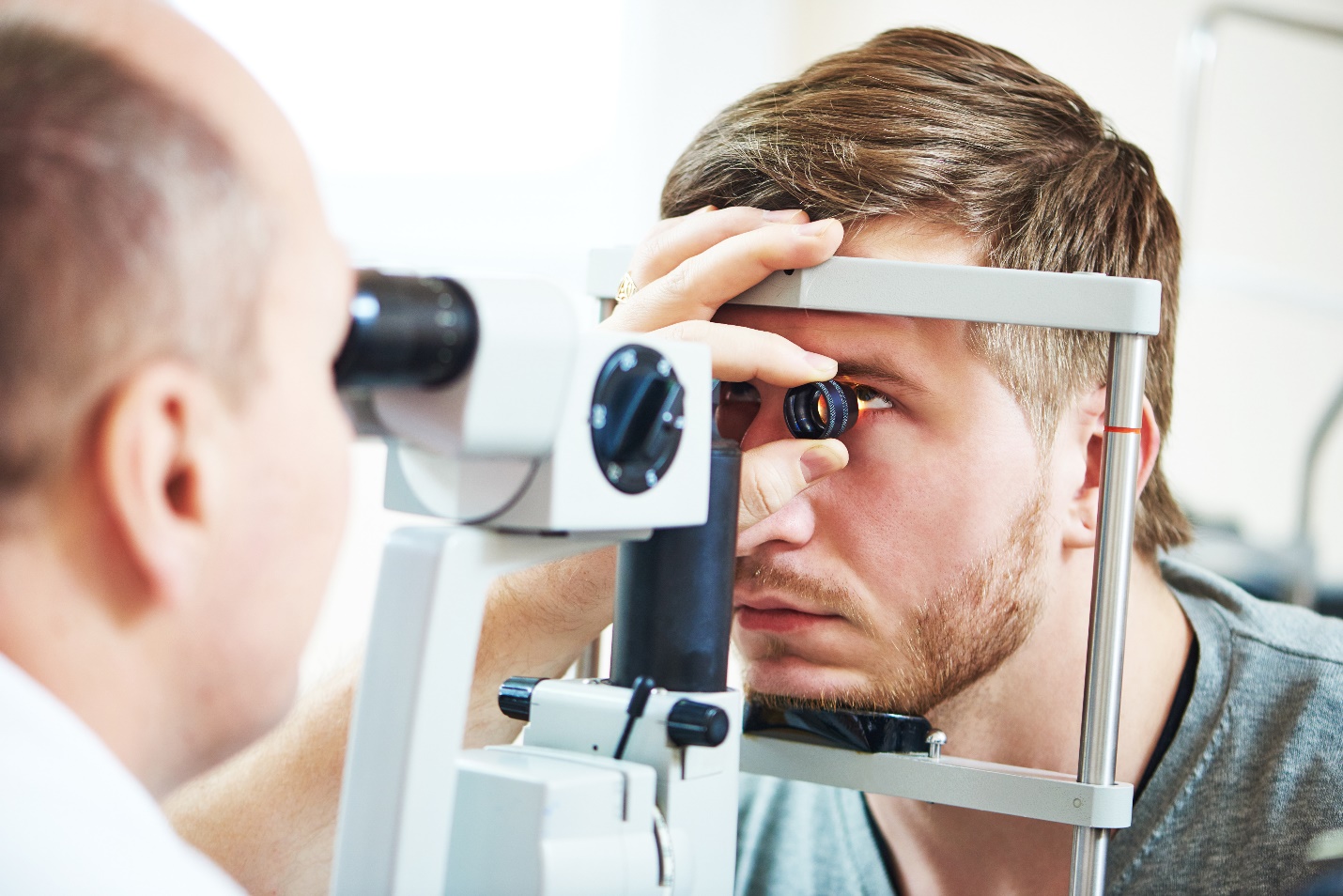 patient under eye vision examination in eyesight ophthalmological correction clinic