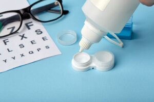 Glasses and lenses for vision correction on a blue background