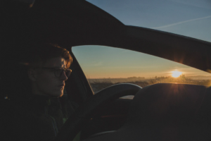 man driving car during daytime