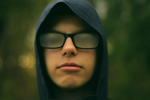 selective focus photography of man wearing eyeglasses